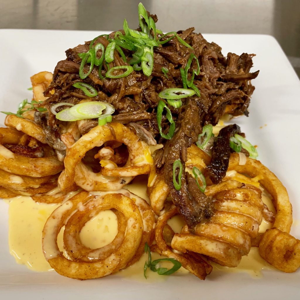 Litte Pub Short Rib Curly Fries 
Beer braised, fork shredded, beef short ribs over crispy curly fries smothered in a beer cheese sauce 